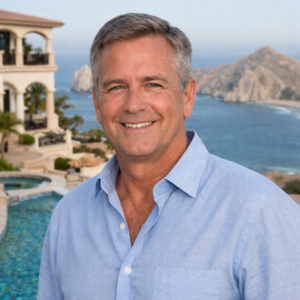 pedregal cabo san lucas homeowner standing on terrace overlooking pacific ocean solar energy homeowner testimonial los cabos mexico