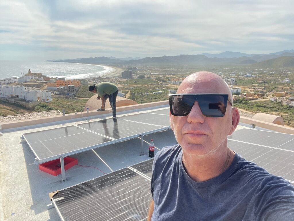 Luxury home solar installation in Los Cabos with rooftop solar panels overlooking the ocean by Cabo Solar Experts