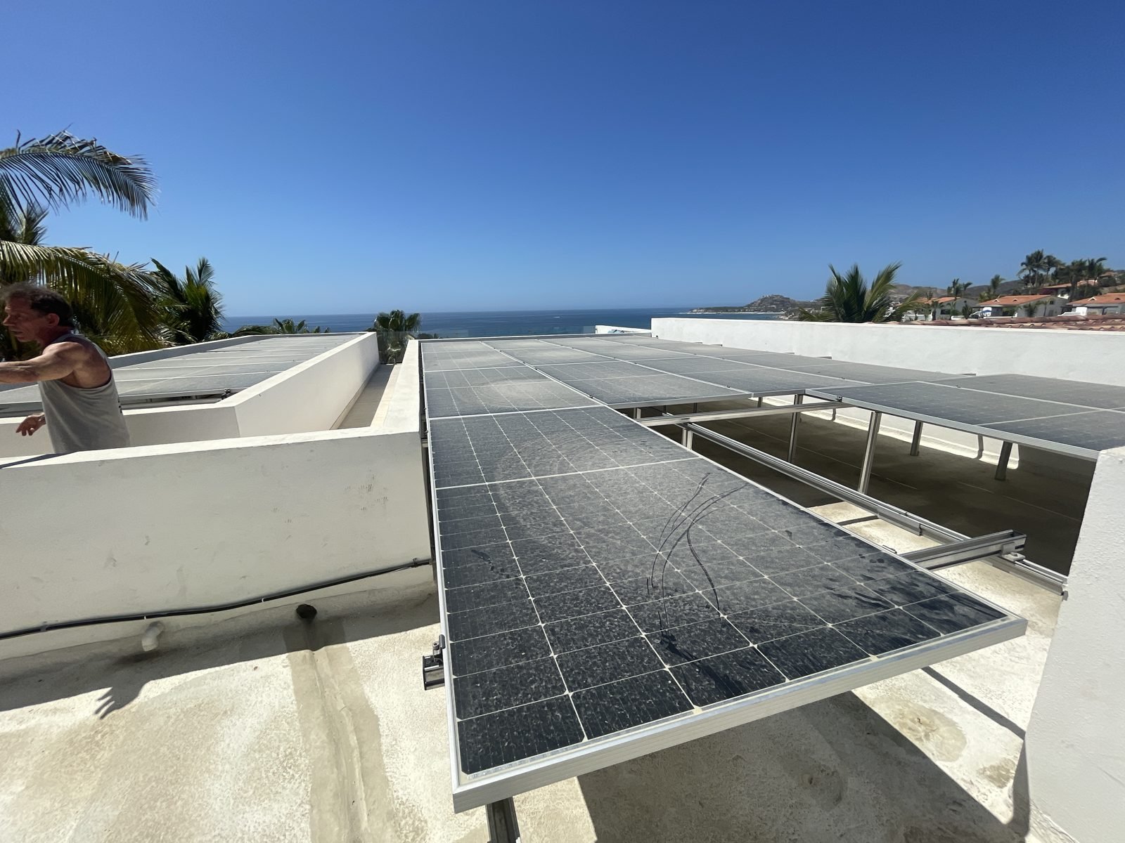 Los Cabos blackouts solar battery backup: rooftop solar panels installed by Cabo Solar Experts with an ocean view