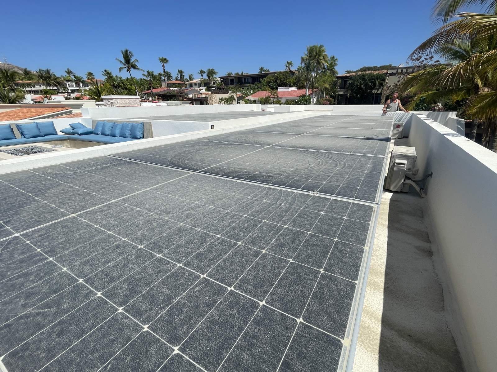 Solar panel rows on a flat rooftop