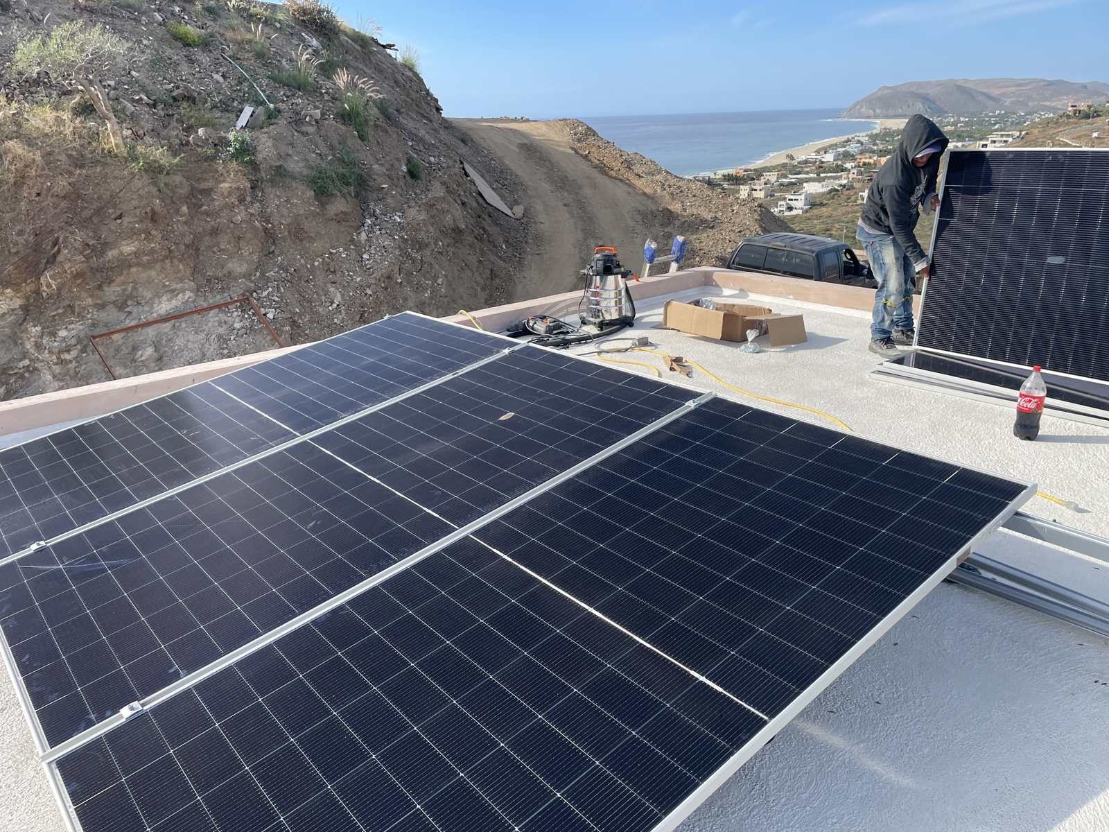 Rows of solar panels installed on a flat roof